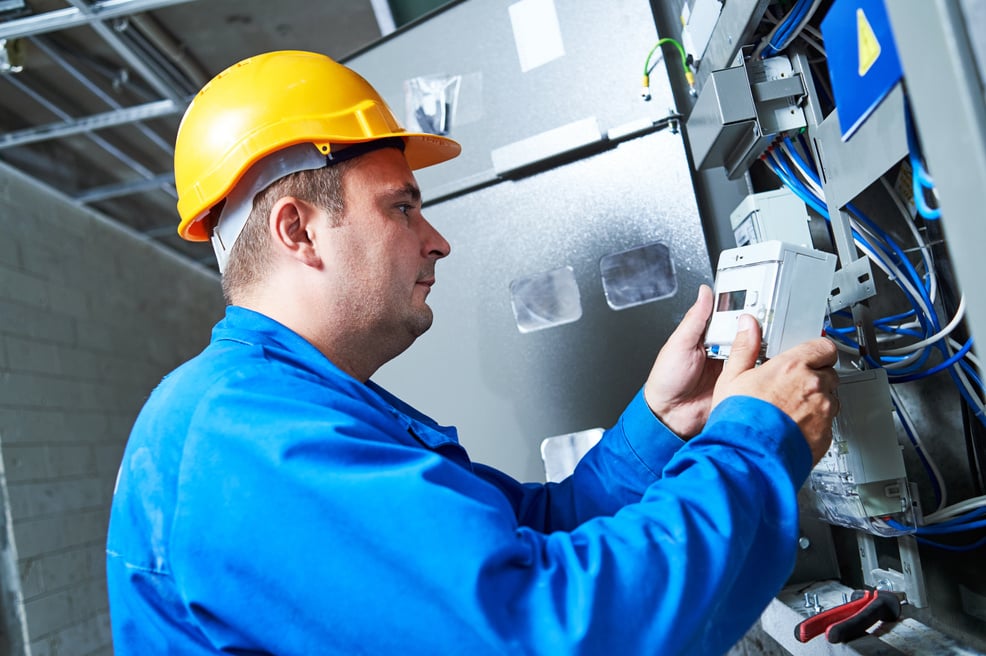 Electrician Installing Energy Saving Meter